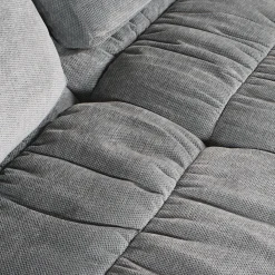 Sofa roulé et compressé dans une boite